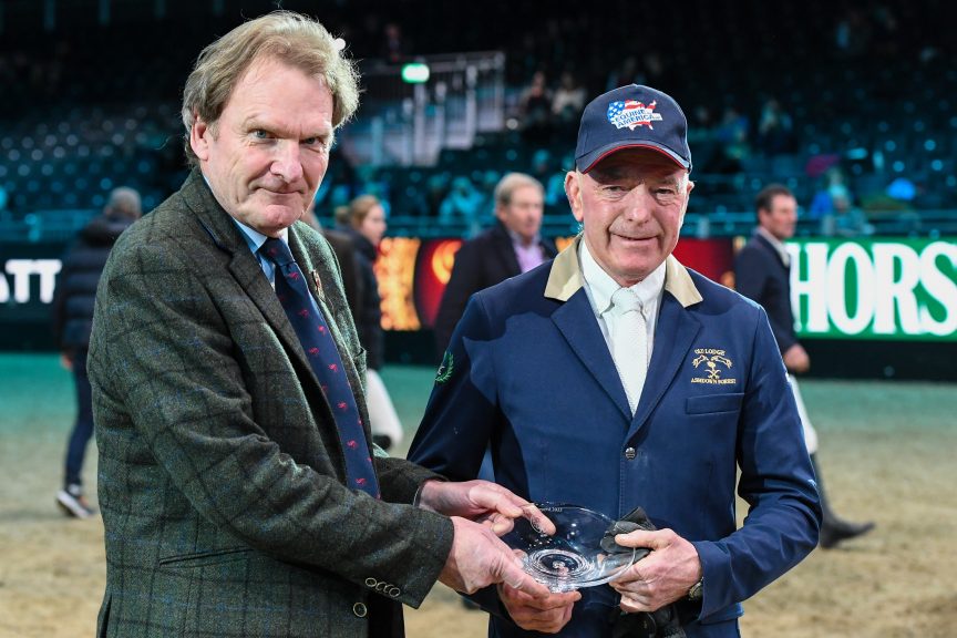 Youth and experience - John Whitaker is presented with his award at London international Horse Show